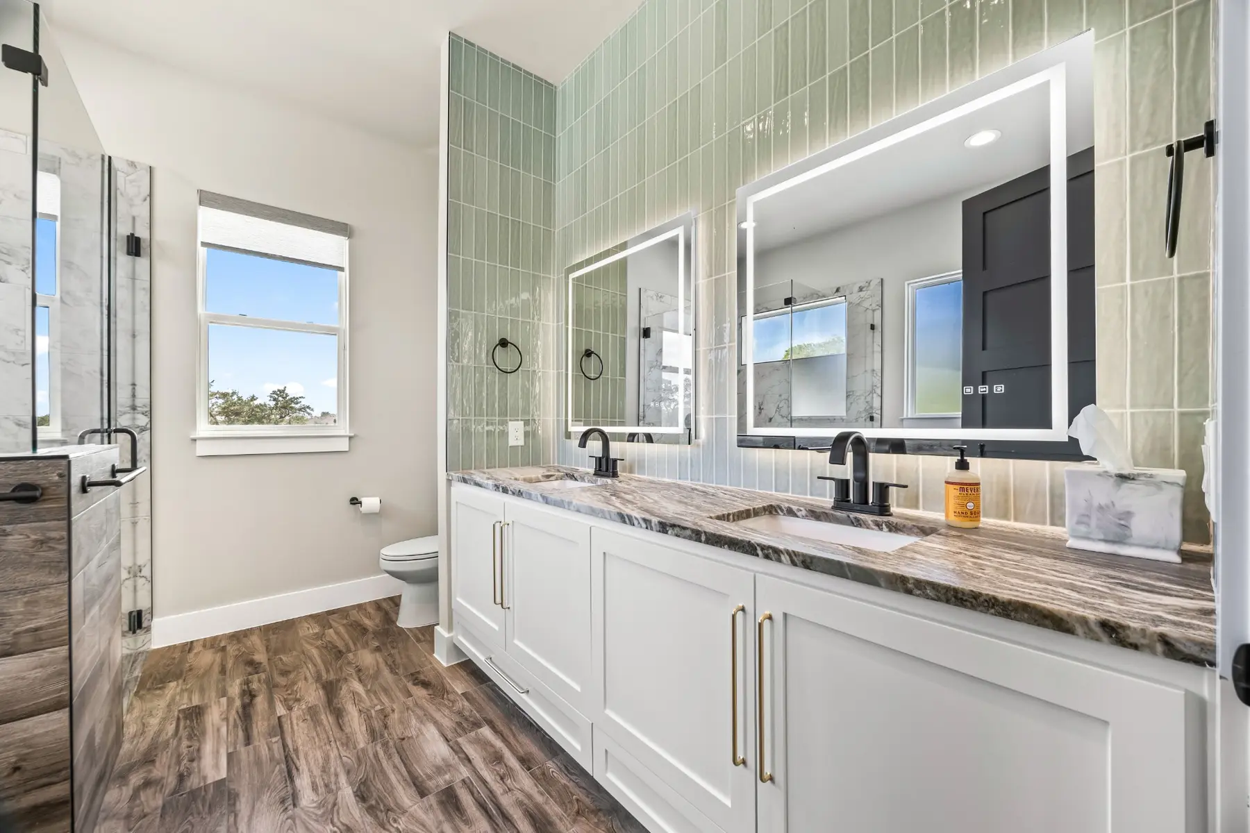 Brook Canyon guest bathroom with illuminated mirror and custom vanity