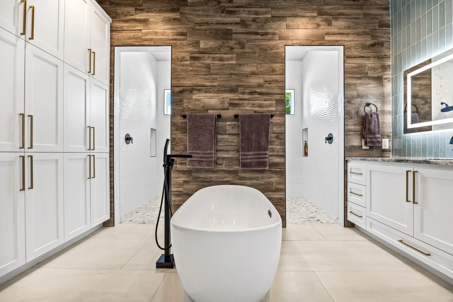Brook Canyon primary bathroom with freestanding tub and wood-look feature wall
